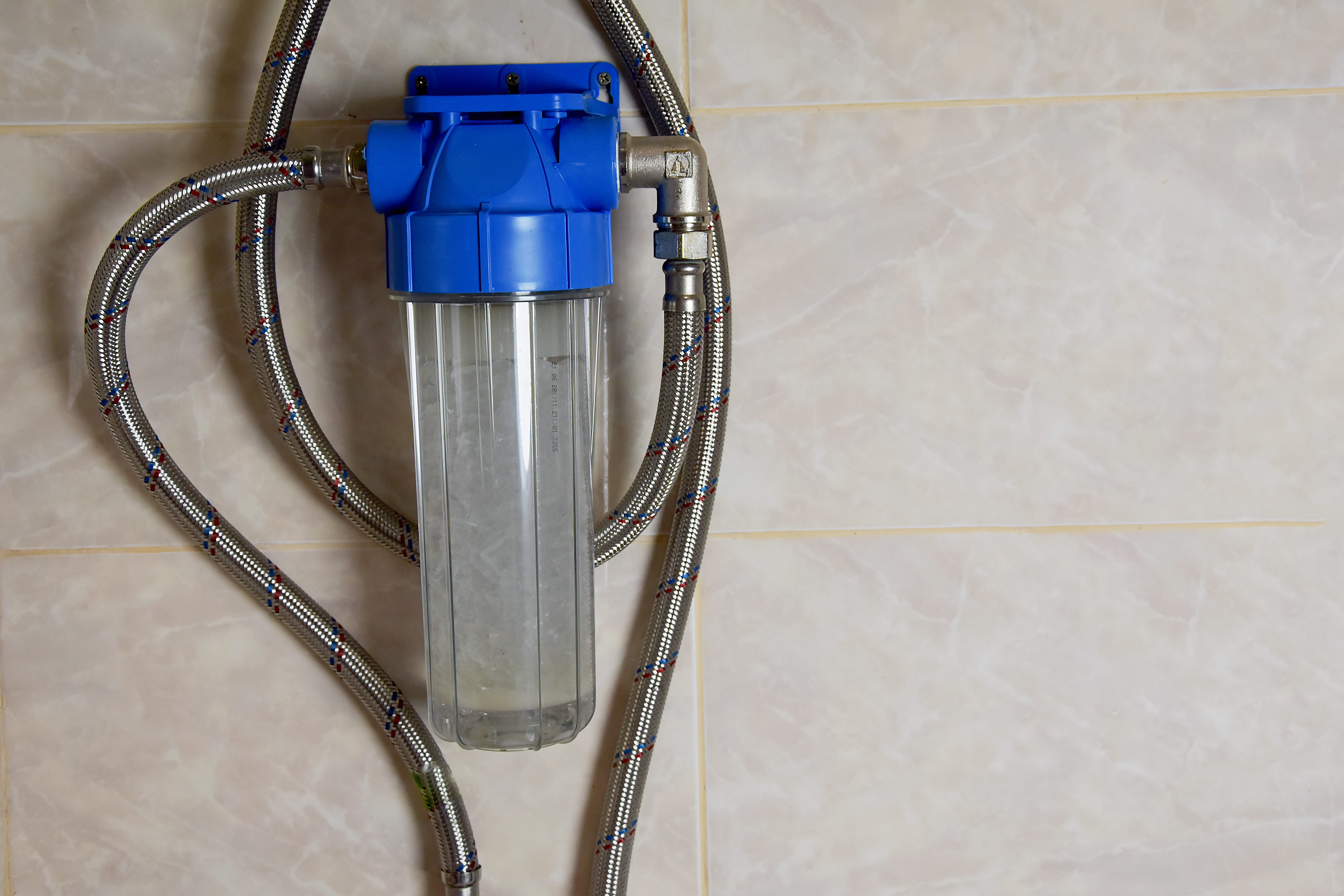 Close-up view of a compact water softening and filtration system